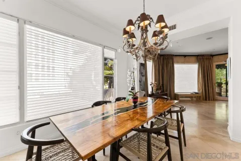 a dining room with furniture and window