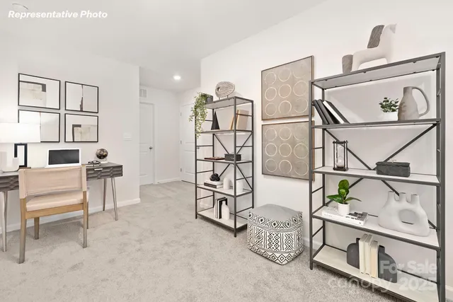 a view of livingroom with furniture and workspace