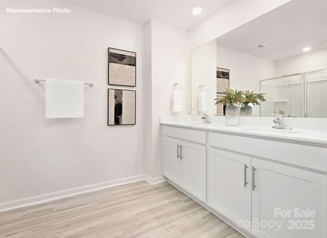 a bathroom with a shower and a sink
