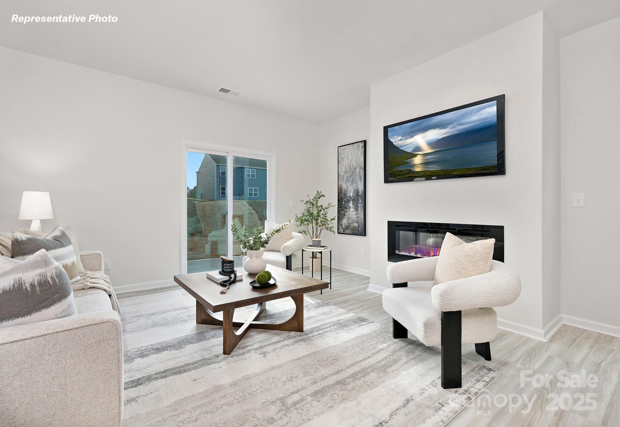 2693 Goose Fair Road Maiden, NC 28650 - Photo 3 of 29 a living room with furniture and a fireplace