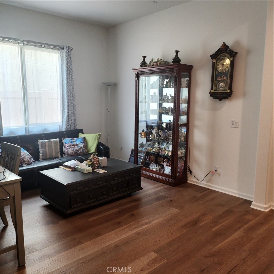 11882 Wandering Way Corona, CA 92883 - Photo 12 of 38 a living room with furniture and wooden floor