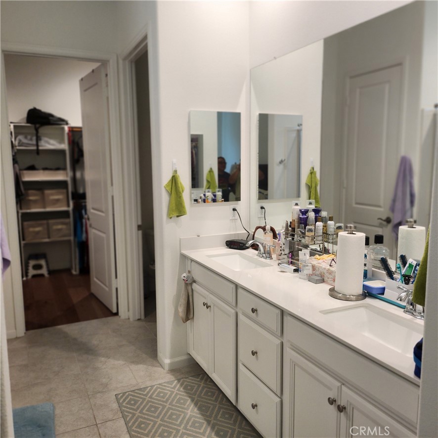 11882 Wandering Way Corona, CA 92883 - Photo 15 of 38 a bathroom with a sink and a mirror