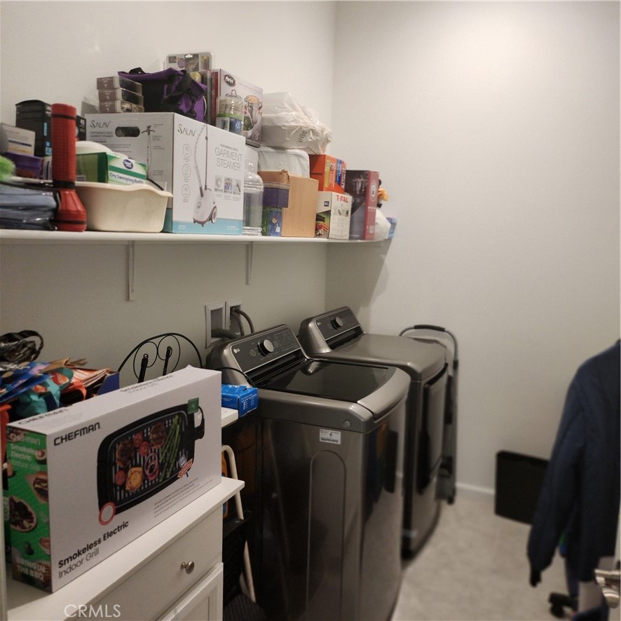 11882 Wandering Way Corona, CA 92883 - Photo 16 of 38 a utility room with multiple dryer and washer