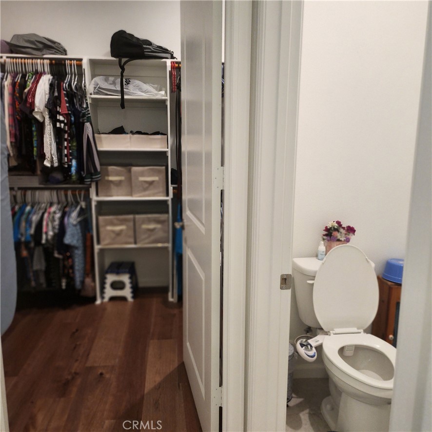 11882 Wandering Way Corona, CA 92883 - Photo 18 of 38 a bathroom with a toilet and a shower
