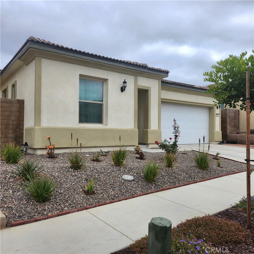 11882 Wandering Way Corona, CA 92883 - Photo 2 of 38 a front view of house with yard and green space