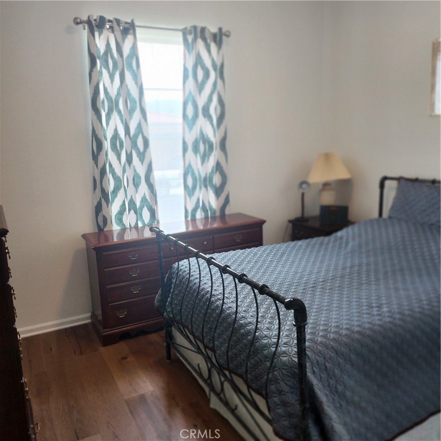11882 Wandering Way Corona, CA 92883 - Photo 21 of 38 a bedroom with a bed and a window