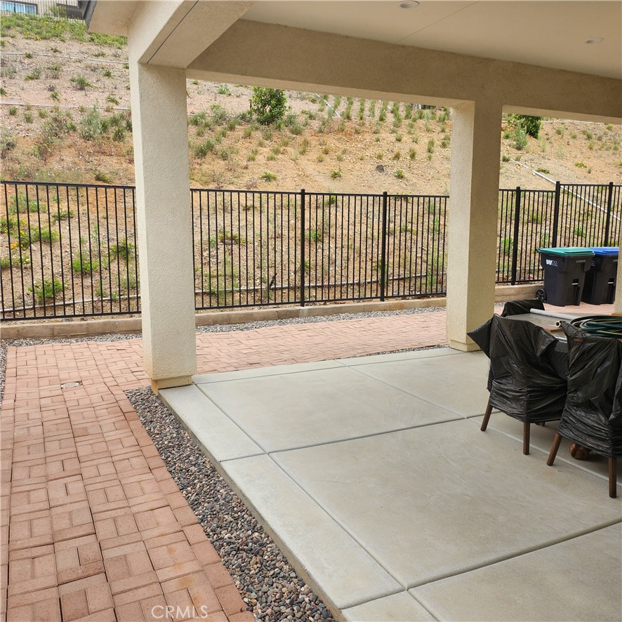 11882 Wandering Way Corona, CA 92883 - Photo 29 of 38 a view of a chairs and table in a balcony