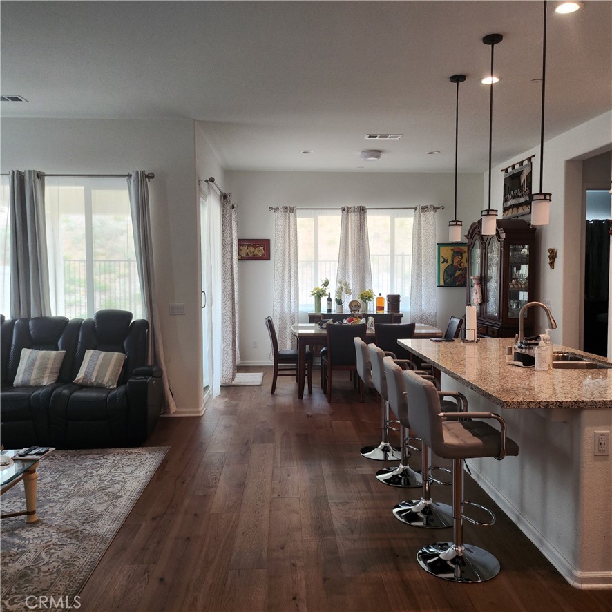 11882 Wandering Way Corona, CA 92883 - Photo 3 of 38 a living room with furniture and wooden floor