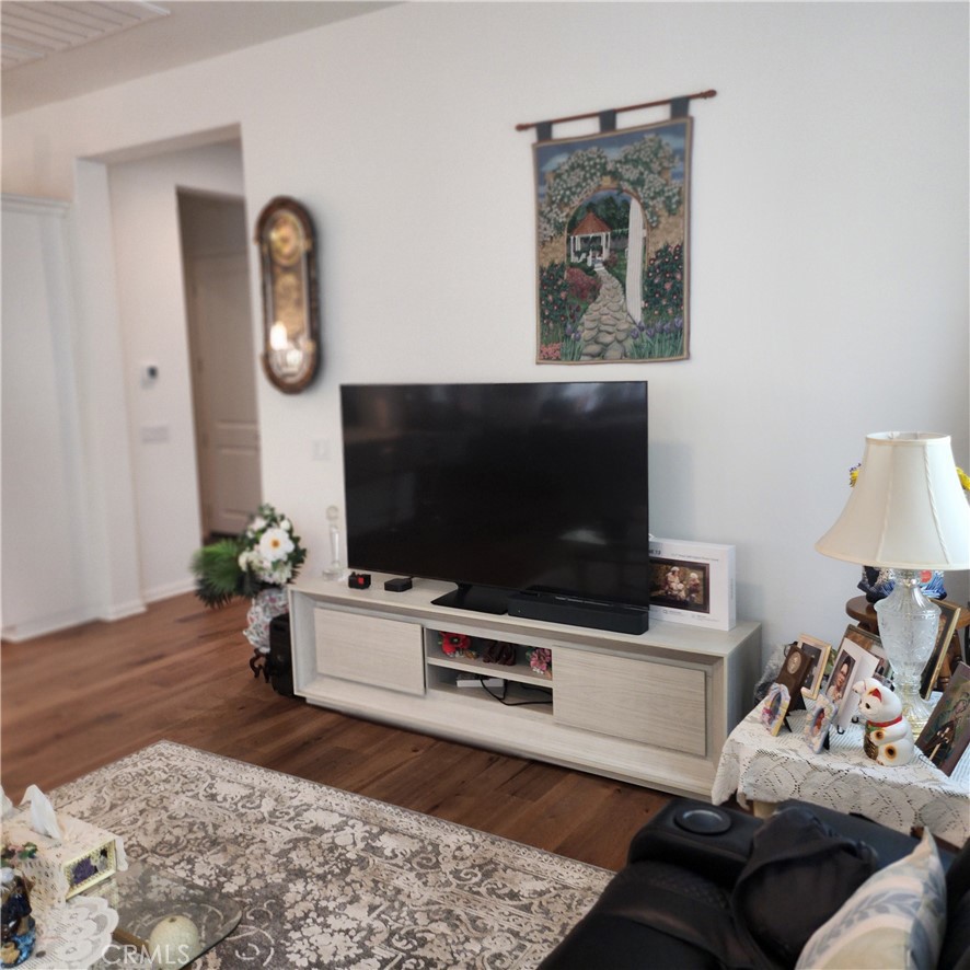 11882 Wandering Way Corona, CA 92883 - Photo 7 of 38 a living room with furniture and a flat screen tv
