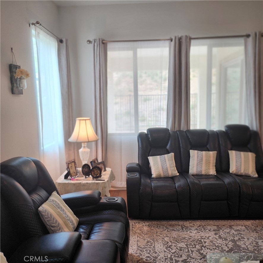 11882 Wandering Way Corona, CA 92883 - Photo 8 of 38 a living room with furniture and a large window