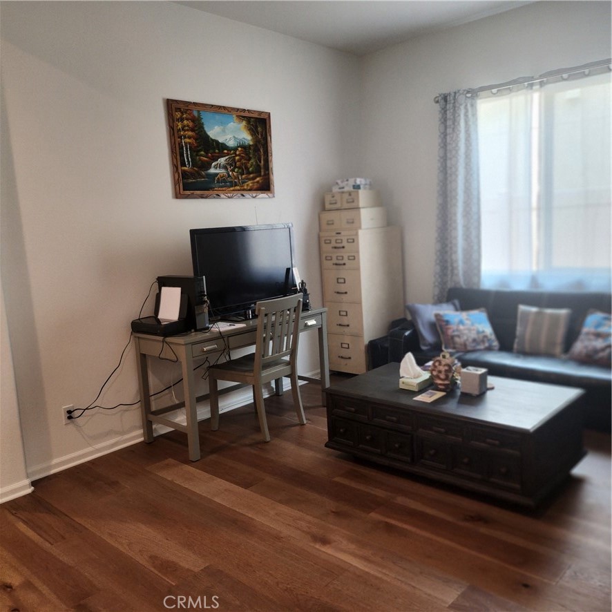 11882 Wandering Way Corona, CA 92883 - Photo 10 of 38 a living room with furniture and a flat screen tv