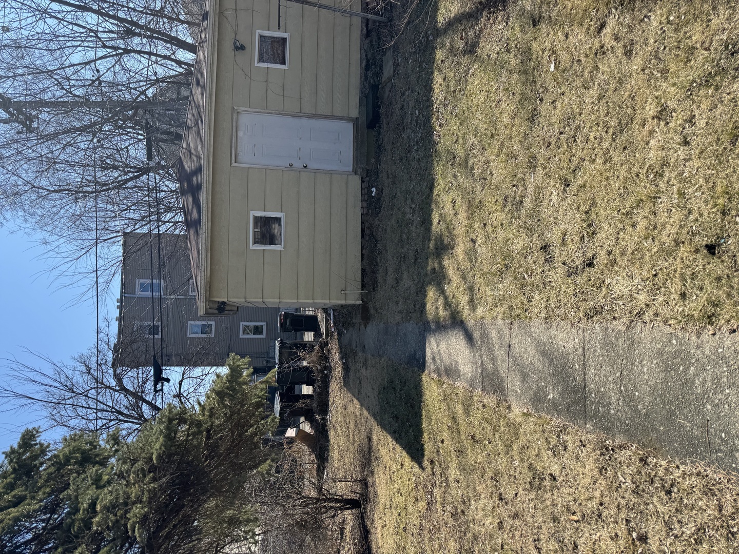 5943 West Huron Street Chicago, IL 60644 - Photo 3 of 9 a house with trees in front of it