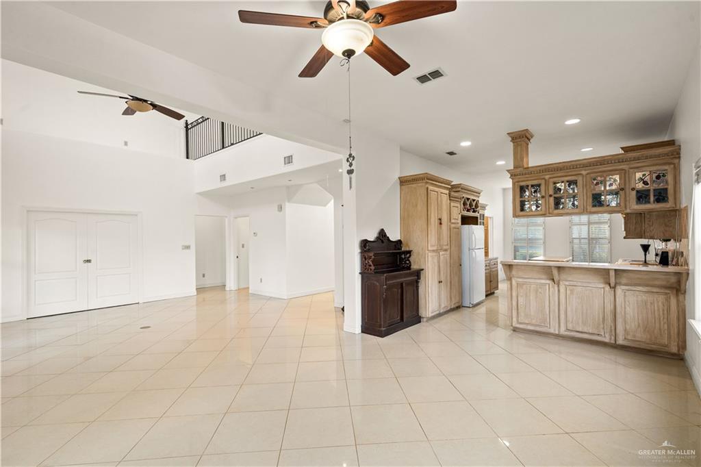912 North Bentsen Road McAllen, TX 78501 - Photo 16 of 45 a large white kitchen with a stove a refrigerator and cabinets