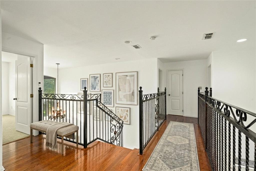 912 North Bentsen Road McAllen, TX 78501 - Photo 29 of 45 a view of a hallway with wooden floor and staircase