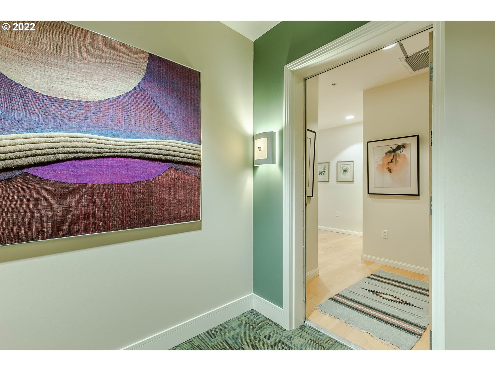 1375 Olive Street, Unit 201 Eugene, OR 97401 - Photo 2 of 32 a view of a room with wooden floor and a bathroom