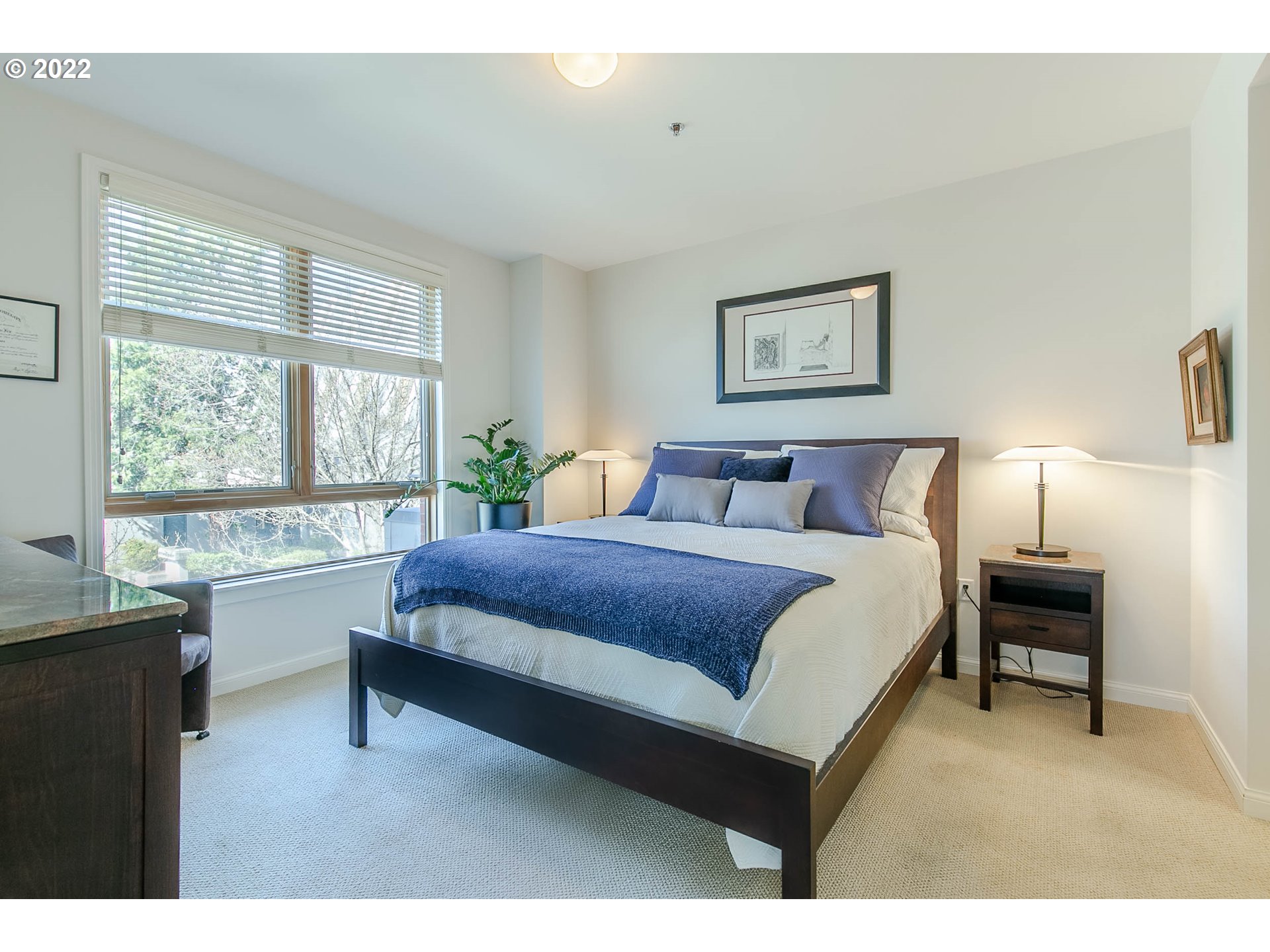1375 Olive Street, Unit 201 Eugene, OR 97401 - Photo 21 of 32 a bedroom with a bed and a large window