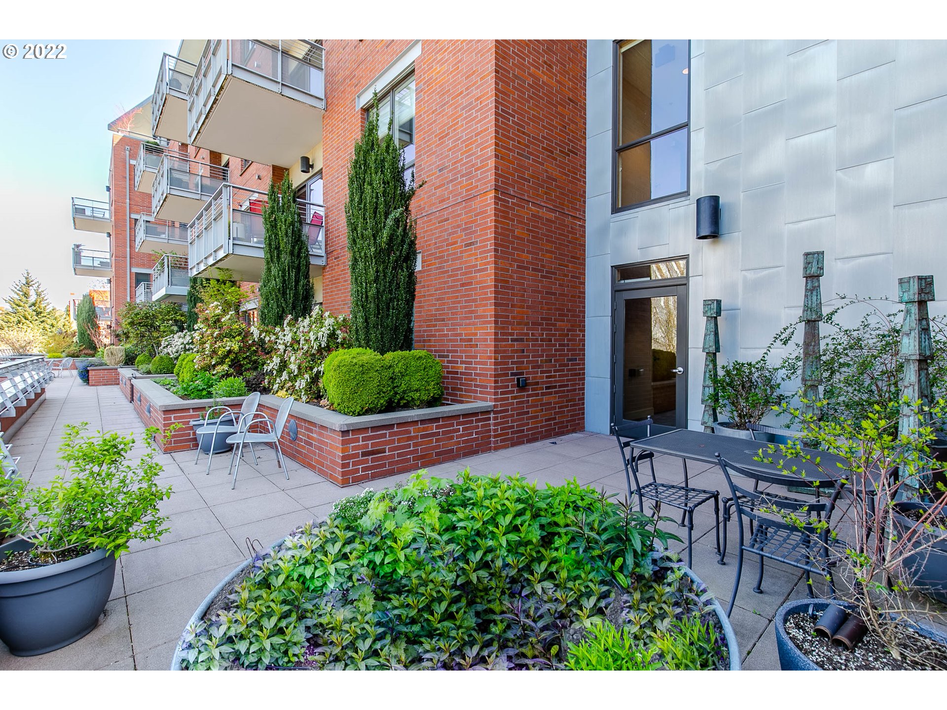 1375 Olive Street, Unit 201 Eugene, OR 97401 - Photo 28 of 32 a couple of flower plants in front of building