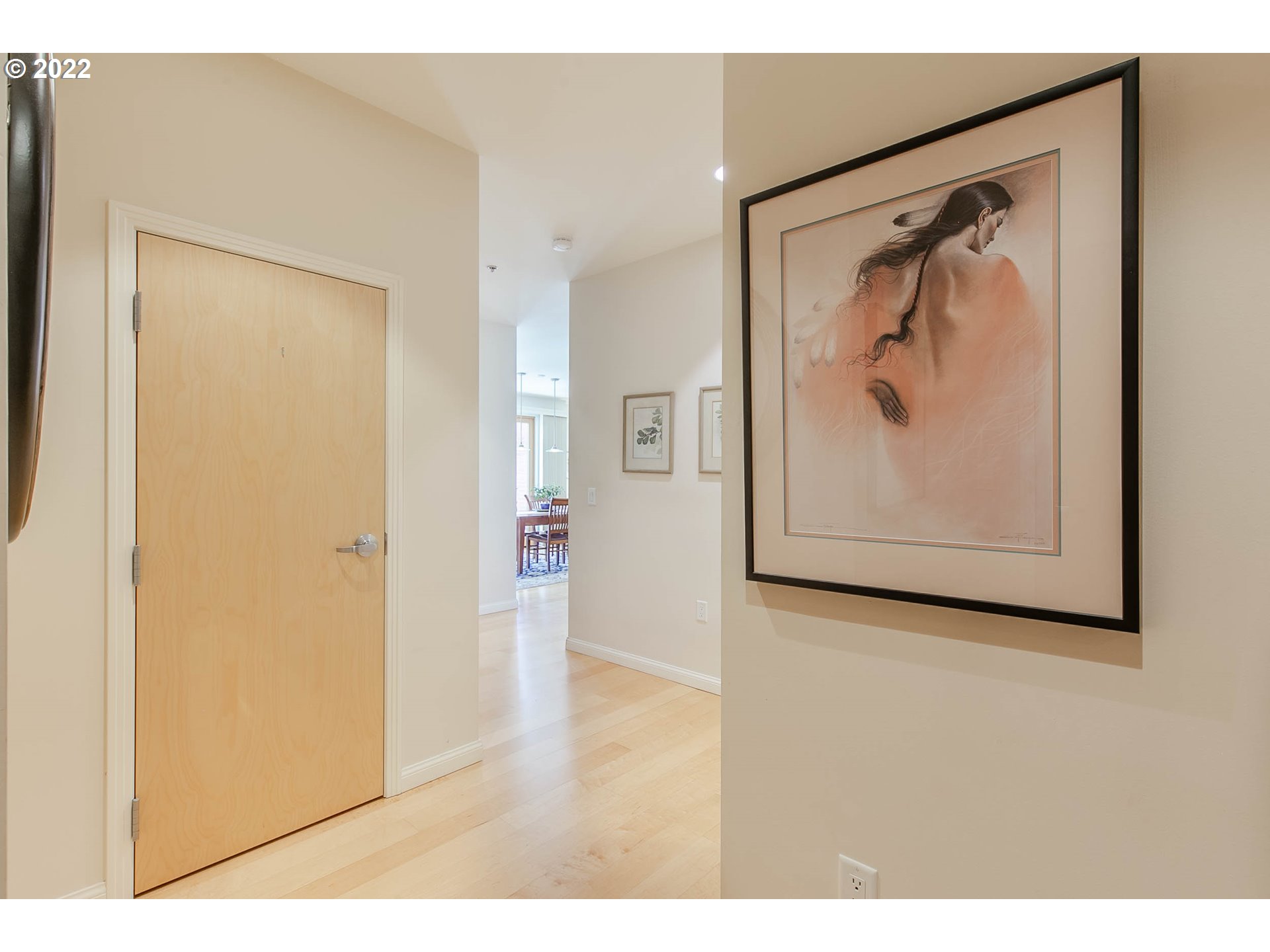 1375 Olive Street, Unit 201 Eugene, OR 97401 - Photo 3 of 32 a view of a hallway with paintings on the wall