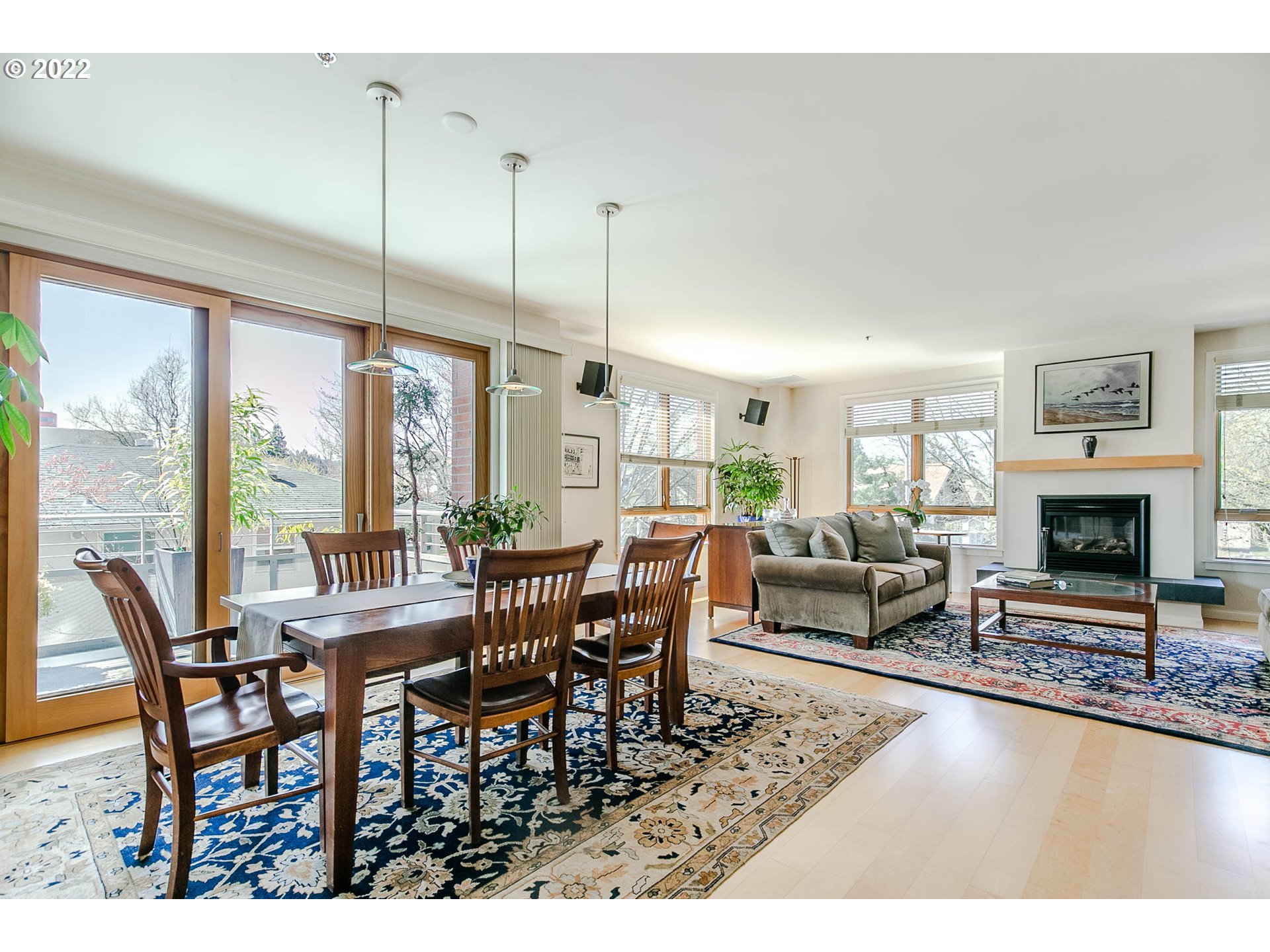 1375 Olive Street, Unit 201 Eugene, OR 97401 - Photo 6 of 32 a living room with furniture a large window and a fireplace
