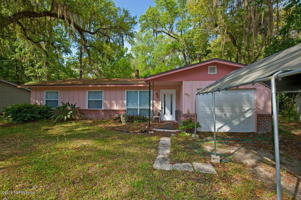1975 Deer Run Road St. Augustine, FL 32084 - Photo 1 of 35 a front view of a house with a yard