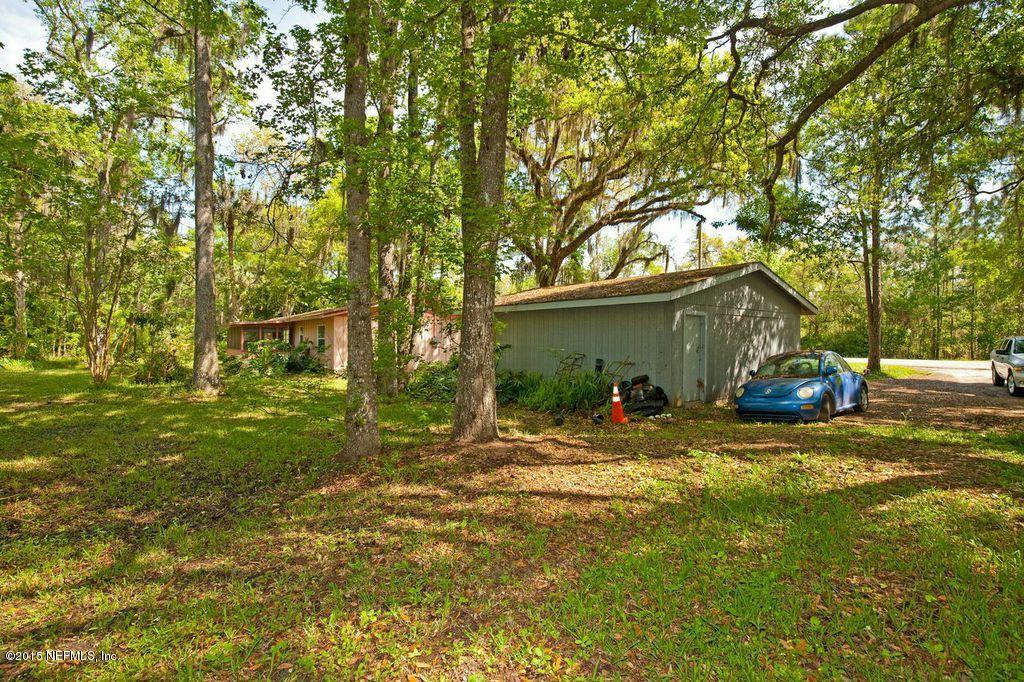 1975 Deer Run Road St. Augustine, FL 32084 - Photo 12 of 35 a view of a house with backyard and trees