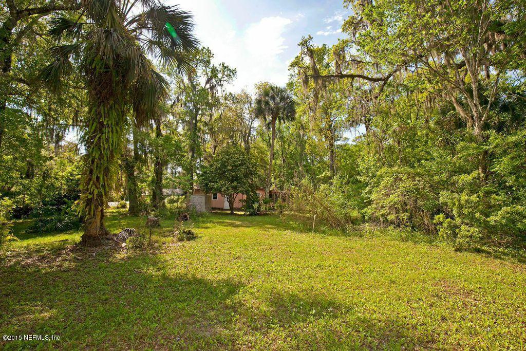 1975 Deer Run Road St. Augustine, FL 32084 - Photo 13 of 35 a view of yard with swimming pool and green space
