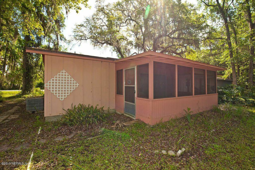 1975 Deer Run Road St. Augustine, FL 32084 - Photo 15 of 35 a front view of a house with garden
