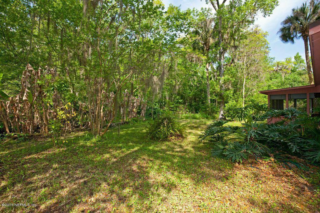 1975 Deer Run Road St. Augustine, FL 32084 - Photo 18 of 35 a view of a yard with plants and a trees