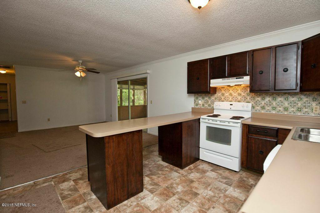 1975 Deer Run Road St. Augustine, FL 32084 - Photo 2 of 35 a kitchen with a stove and a sink