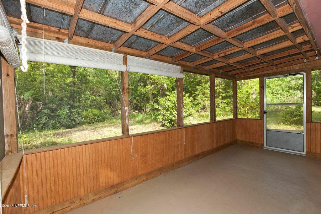 1975 Deer Run Road St. Augustine, FL 32084 - Photo 21 of 35 a view of empty room with wooden floor and iron fence