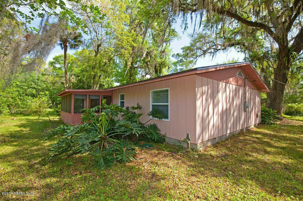 1975 Deer Run Road St. Augustine, FL 32084 - Photo 24 of 35 front view of a house with a yard