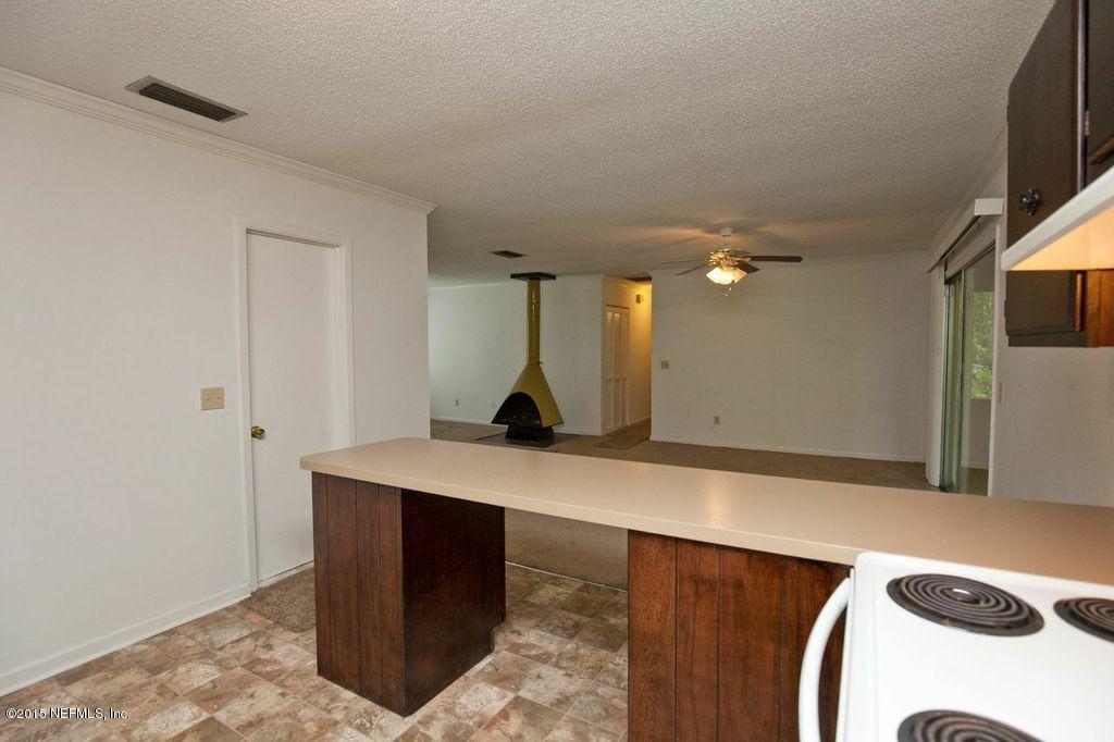 1975 Deer Run Road St. Augustine, FL 32084 - Photo 4 of 35 a room with a sink and a mirror