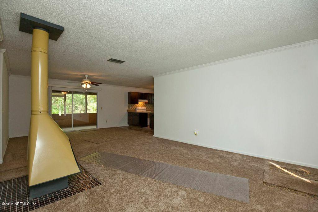 1975 Deer Run Road St. Augustine, FL 32084 - Photo 5 of 35 a view of empty room with wooden floor and window