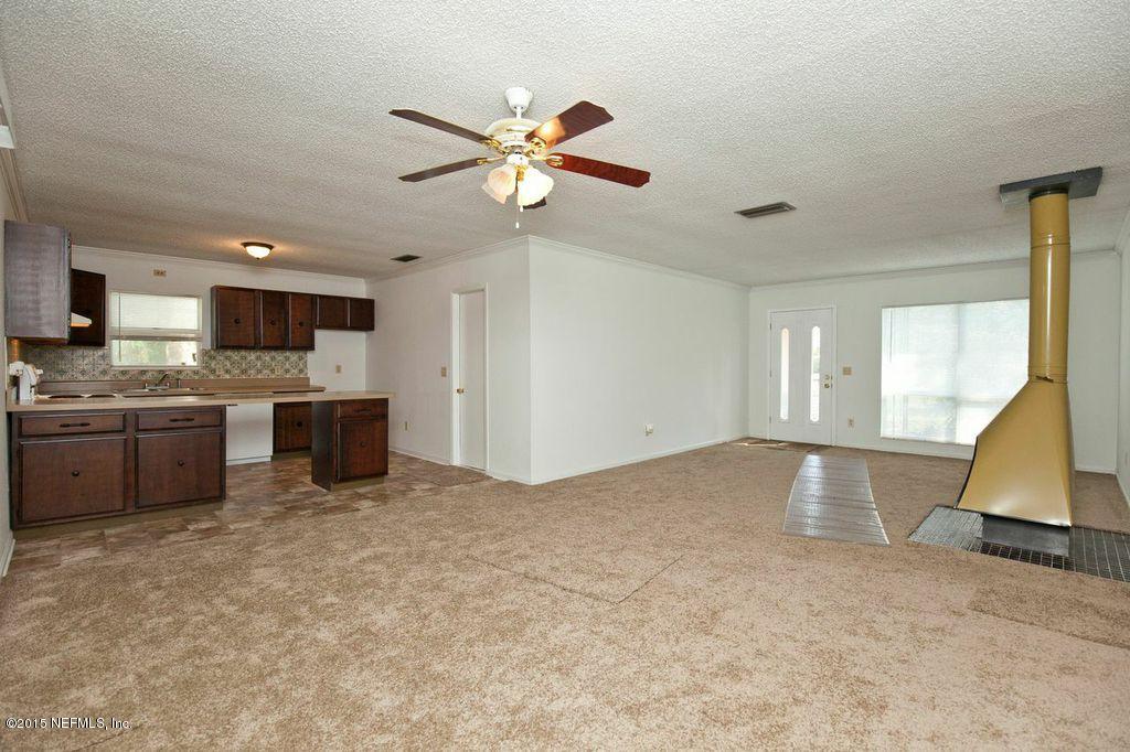 1975 Deer Run Road St. Augustine, FL 32084 - Photo 6 of 35 a view of a kitchen with a sink hardwood floor and a window