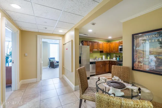 a room with furniture and a floor to ceiling window