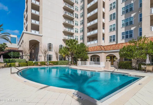 a view of pool with outdoor seating