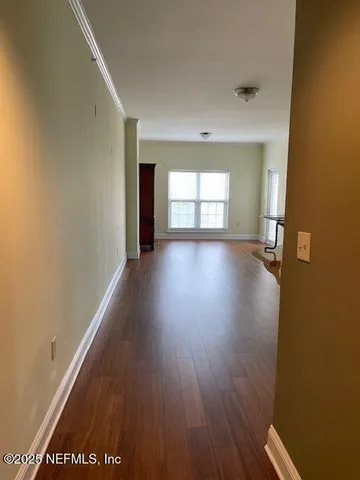 a view of kitchen with wooden floor and a sink