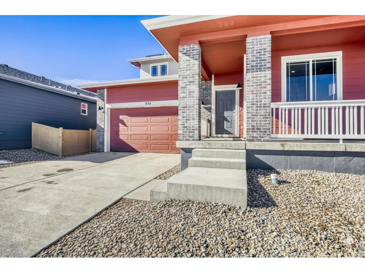 656 Noola Street Windsor, CO 80550 - Photo 21 of 33 EXTERIOR SHOT OF 656 NOOLA - MODERN PRAIRIE ELEVATION WITH A FRONT WRAP AROUND COVERED PORCH.