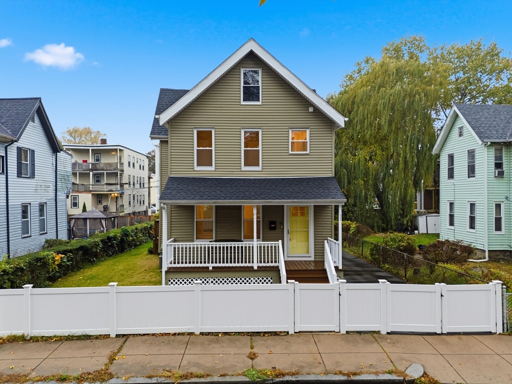 31 Chipman Street Boston, MA 02124 - Photo 1 of 37 a front view of a house with garden