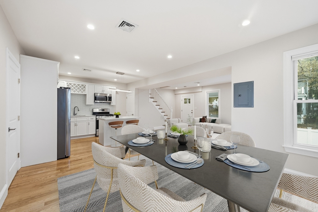 31 Chipman Street Boston, MA 02124 - Photo 11 of 37 a dining room with furniture and wooden floor