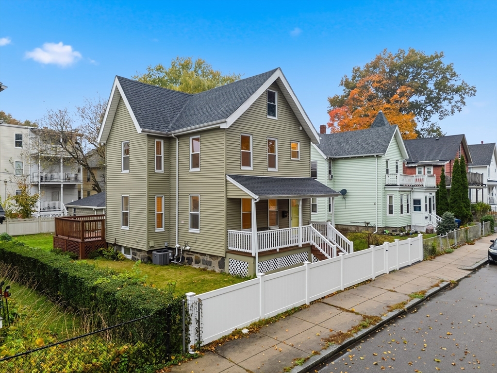 31 Chipman Street Boston, MA 02124 - Photo 2 of 37 a front view of a house with garden