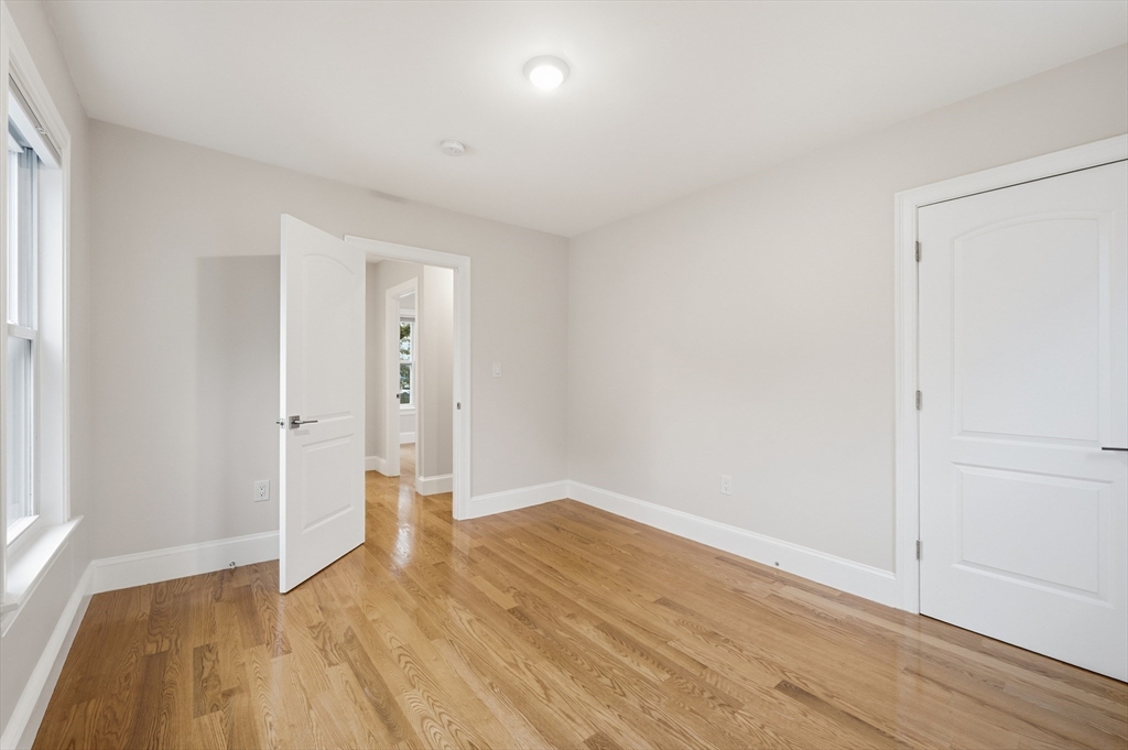 31 Chipman Street Boston, MA 02124 - Photo 24 of 37 wooden floor in an empty room