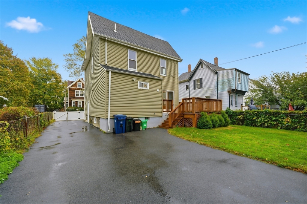 31 Chipman Street Boston, MA 02124 - Photo 31 of 37 a view of a house with a yard and large tree