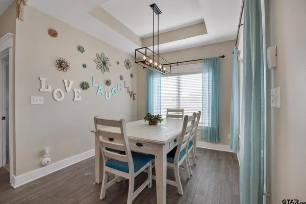a view of a dining table and chairs in a room