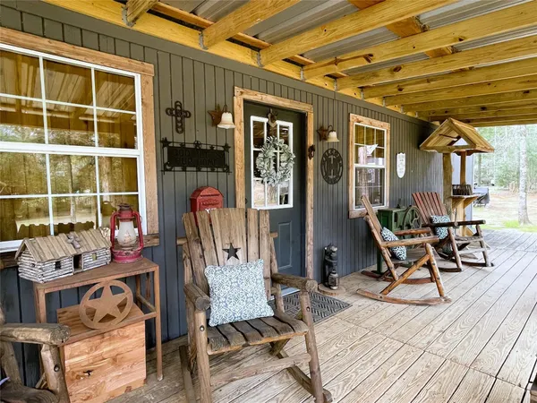 a living room with furniture and flat screen tv