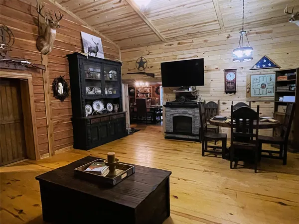 a bedroom with a bed next to a window