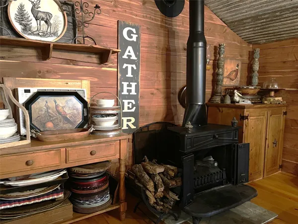 a kitchen with a refrigerator and a stove