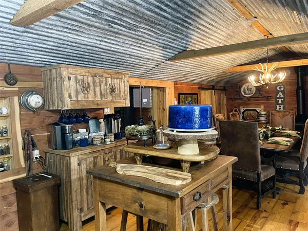 a kitchen with stainless steel appliances granite countertop a refrigerator a stove top oven a sink and dishwasher