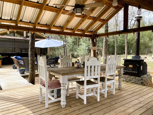 a view of a house with backyard porch and sitting area