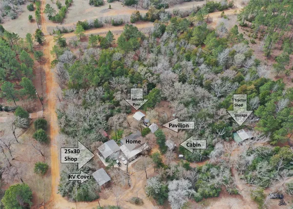 an aerial view of a residential houses with outdoor space